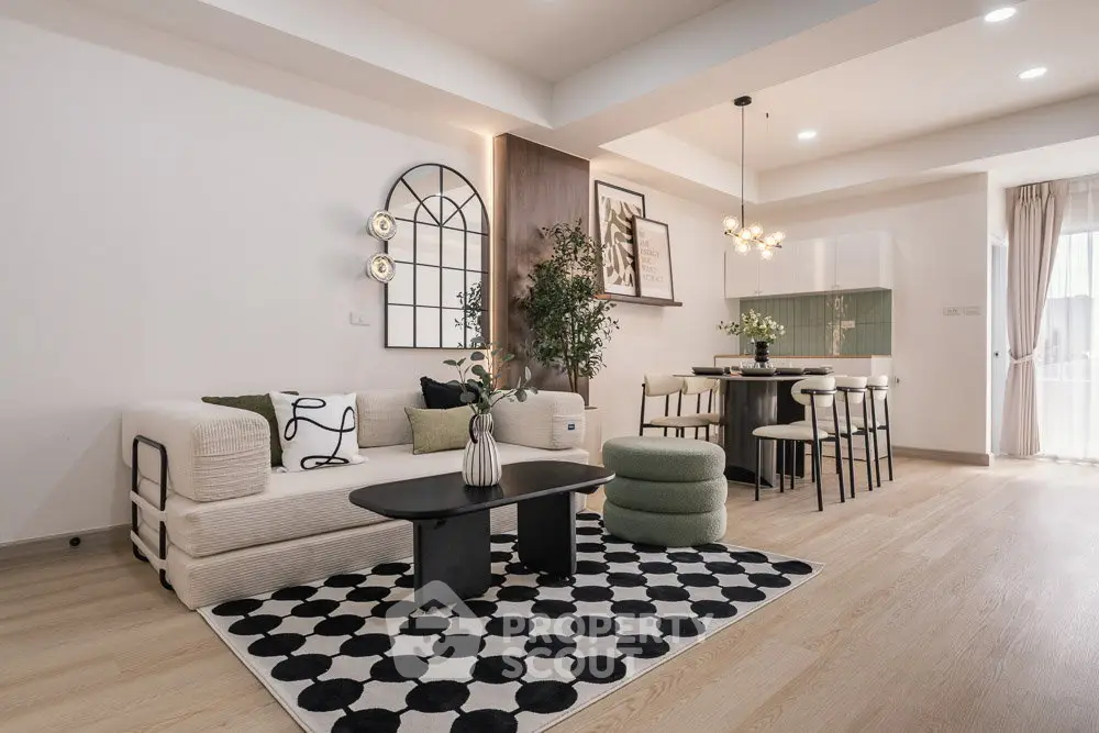Modern open-plan living room with stylish decor and dining area