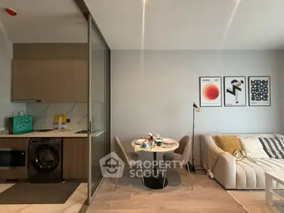 Modern open-plan living room with stylish kitchen and cozy dining area