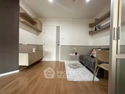 Modern living room with sleek wooden flooring and minimalist furniture design.