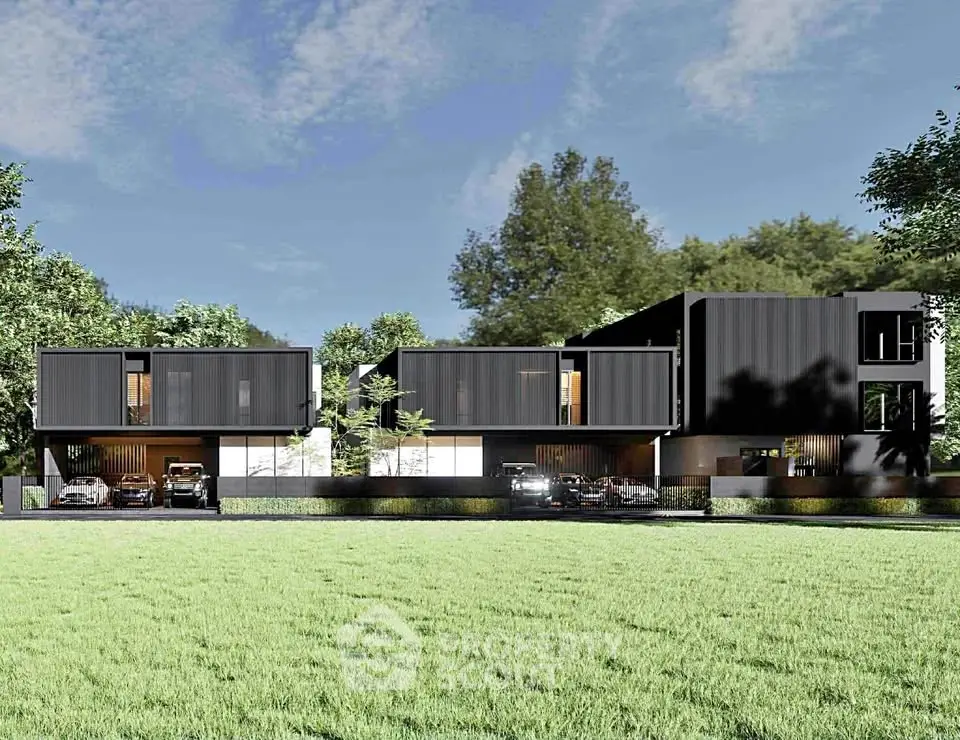 Modern luxury homes with sleek black exteriors and lush green surroundings.