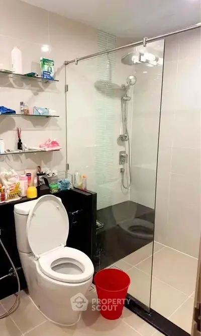Modern bathroom with glass shower and sleek fixtures, perfect for contemporary living.