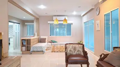 Spacious living room with modern decor and natural light