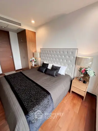 Luxurious bedroom with elegant decor and plush bedding in modern apartment