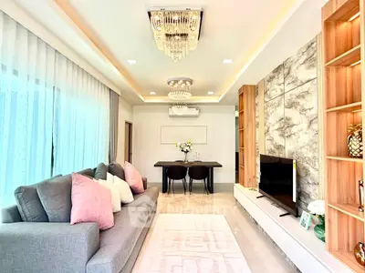 Luxurious living room with elegant chandelier and modern decor