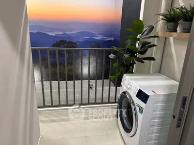 Modern laundry area with scenic mountain view and washing machine