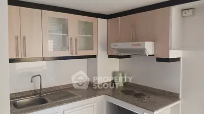 Modern kitchen with granite countertops and sleek cabinetry
