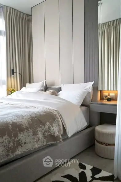 Luxurious modern bedroom with elegant decor and plush bedding