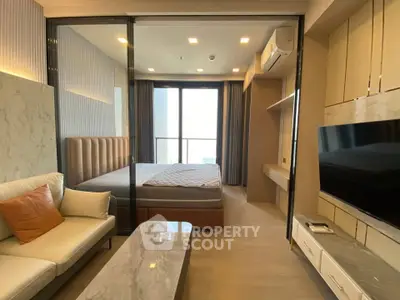 Modern bedroom with large window, stylish furniture, and neutral tones for a cozy ambiance.