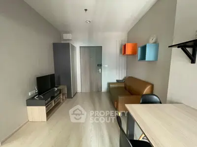 Modern living room with stylish furniture and wall shelves in a cozy apartment.