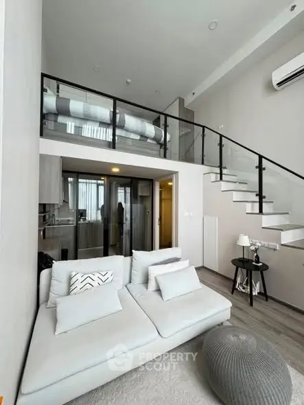 Modern loft apartment with stylish mezzanine and cozy living area