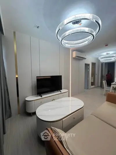 Modern living room with elegant lighting and stylish furniture in a contemporary apartment.