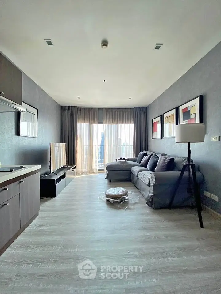 Spacious modern living room with large windows and stylish decor