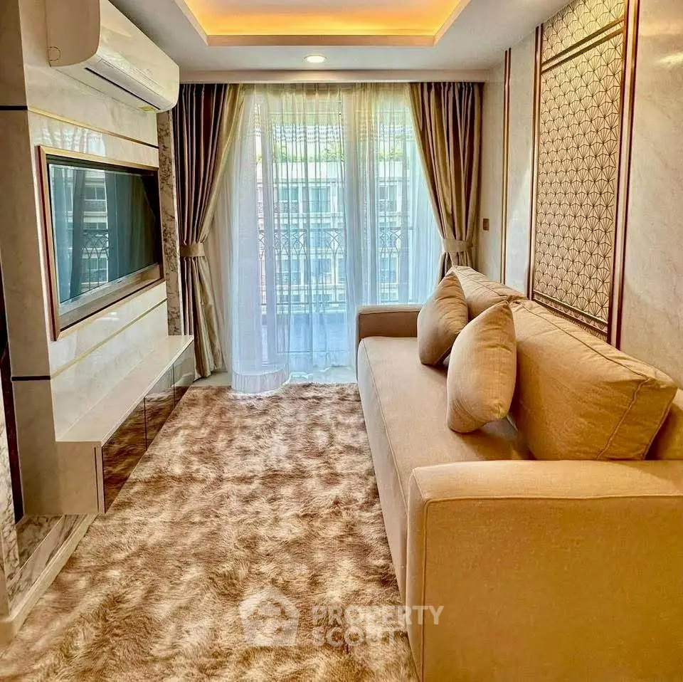 Luxurious living room with plush carpet, elegant curtains, and modern TV setup.