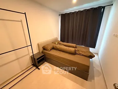 Cozy bedroom with modern minimalist design and ample natural light