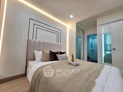 Modern bedroom with elegant lighting and stylish decor