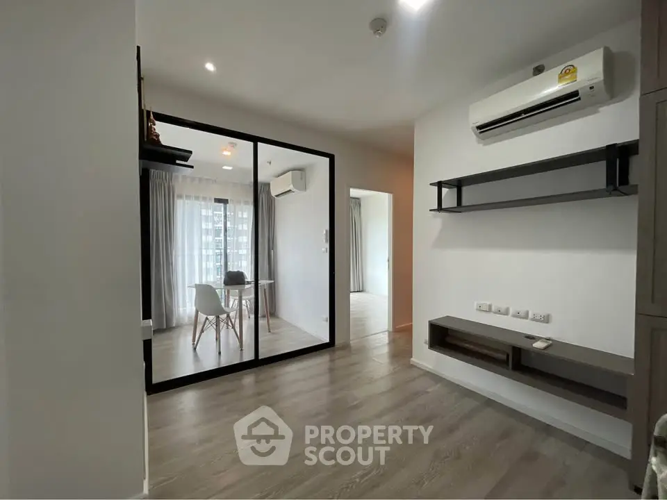 Modern apartment interior with glass partition and air conditioning