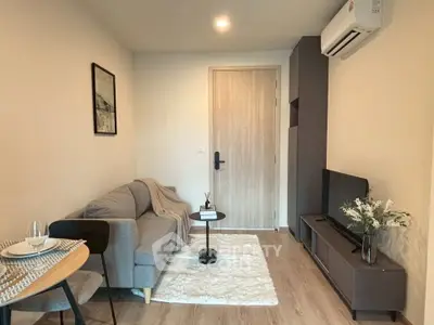 Cozy modern living room with stylish decor and air conditioning