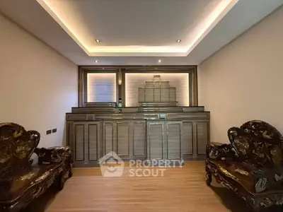 Luxurious living room with elegant wooden furniture and modern lighting