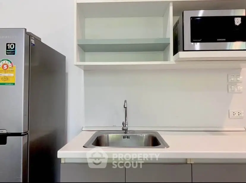 Modern kitchen with stainless steel appliances and sleek cabinetry