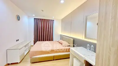 Modern bedroom with elegant decor and ambient lighting, featuring a cozy bed and stylish furniture.