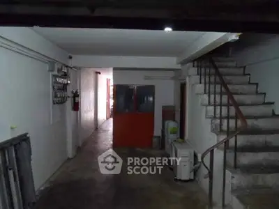 Spacious basement area with staircase and utility features, ideal for storage or renovation.