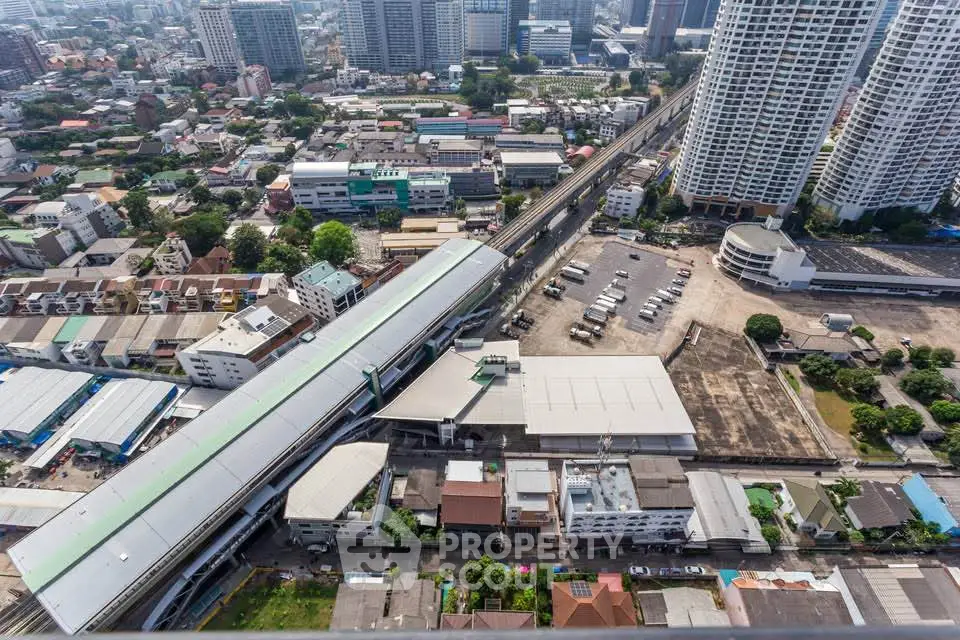Stunning aerial view of urban cityscape with high-rise buildings and bustling streets.