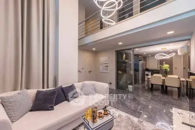 Luxurious modern living room with high ceilings and elegant dining area in open layout apartment.