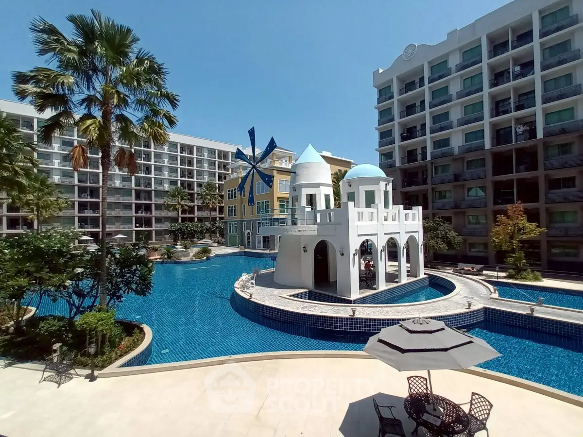 Luxurious apartment complex with stunning pool and unique architectural design