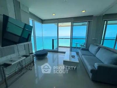 Stunning living room with panoramic ocean view and modern furnishings in luxury apartment.