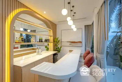 Luxurious home bar with elegant lighting and modern decor, perfect for entertaining guests.