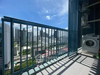 Stunning city view from a high-rise balcony with modern washing machine, perfect urban living.