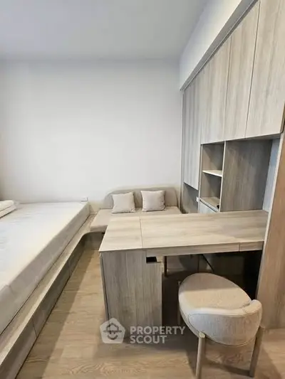 Modern bedroom with integrated study desk and minimalist design