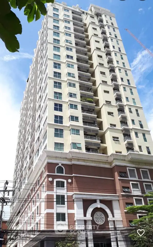 Stunning high-rise building with modern architecture and elegant facade, perfect for urban living.