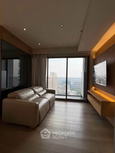 Modern living room with large window and city view, featuring sleek furniture and elegant design.