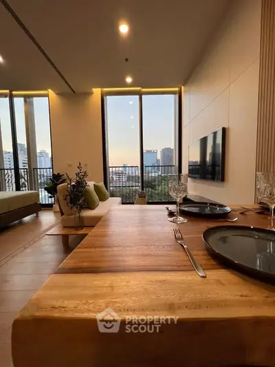 Luxurious living room with stunning city view, elegant dining setup, and modern decor.