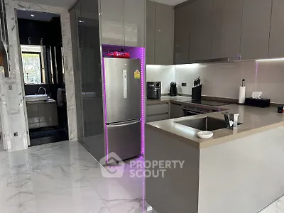 Modern kitchen with sleek cabinetry and stainless steel appliances