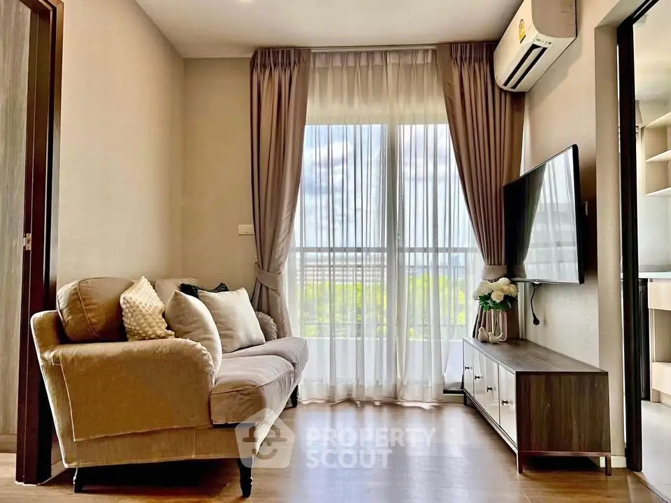 Cozy living room with elegant sofa and large window view