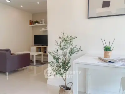 Modern living room with sleek furniture and stylish decor, perfect for contemporary living.