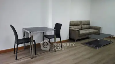 Modern minimalist living room with sleek furniture and hardwood flooring