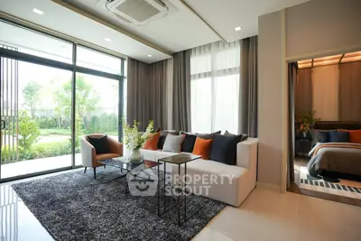 Modern living room with large windows and stylish decor