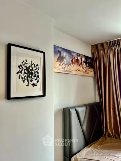 Stylish bedroom with elegant artwork and luxurious curtains