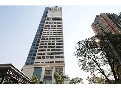 Stunning high-rise building with modern architecture and lush surroundings.