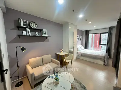 Modern studio apartment with cozy living area and stylish decor