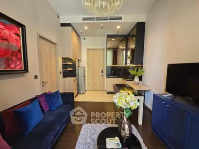 Modern living room with stylish decor and open kitchen layout in a luxury apartment.