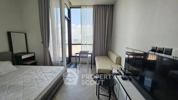 Modern bedroom with balcony view and stylish furnishings