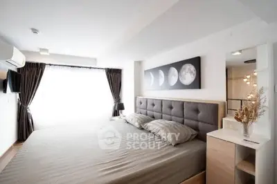 Spacious modern bedroom with elegant decor and natural light