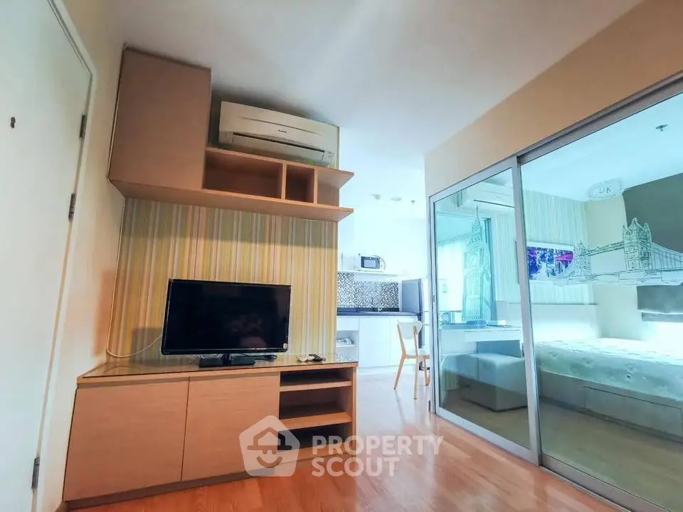 Modern apartment interior with open layout, featuring a cozy living area and stylish bedroom.