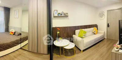 Modern living room with cozy decor and adjacent bedroom in stylish apartment