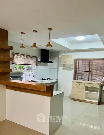 Modern kitchen with open layout and stylish wooden accents