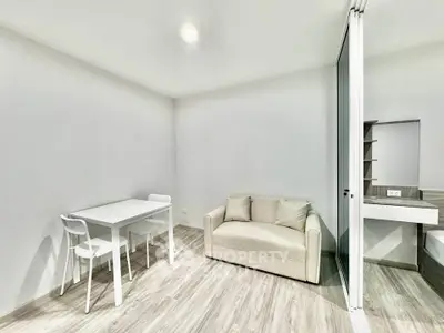 Modern minimalist living room with sleek furniture and neutral tones, perfect for cozy urban living.